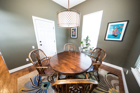 brown wooden dining set and lights